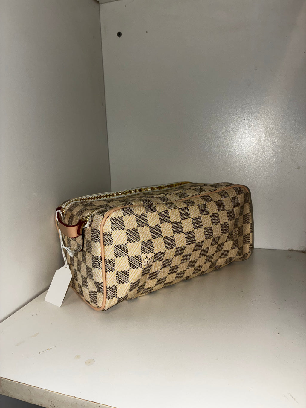 LV Toiletry Dopp Kit in the Damier Azur canvas pattern.