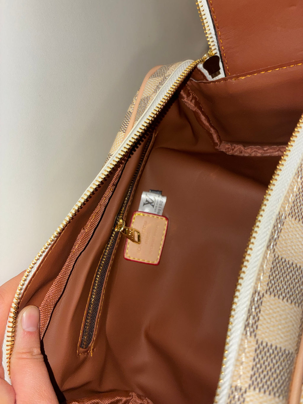 LV Toiletry Dopp Kit in the Damier Azur canvas pattern.