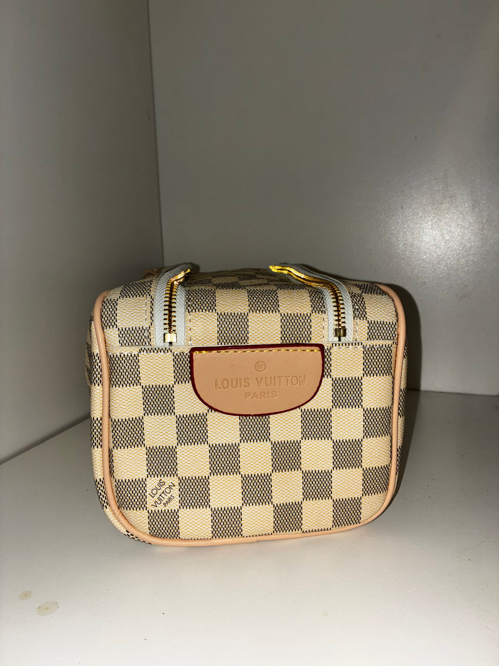 LV Toiletry Dopp Kit in the Damier Azur canvas pattern.