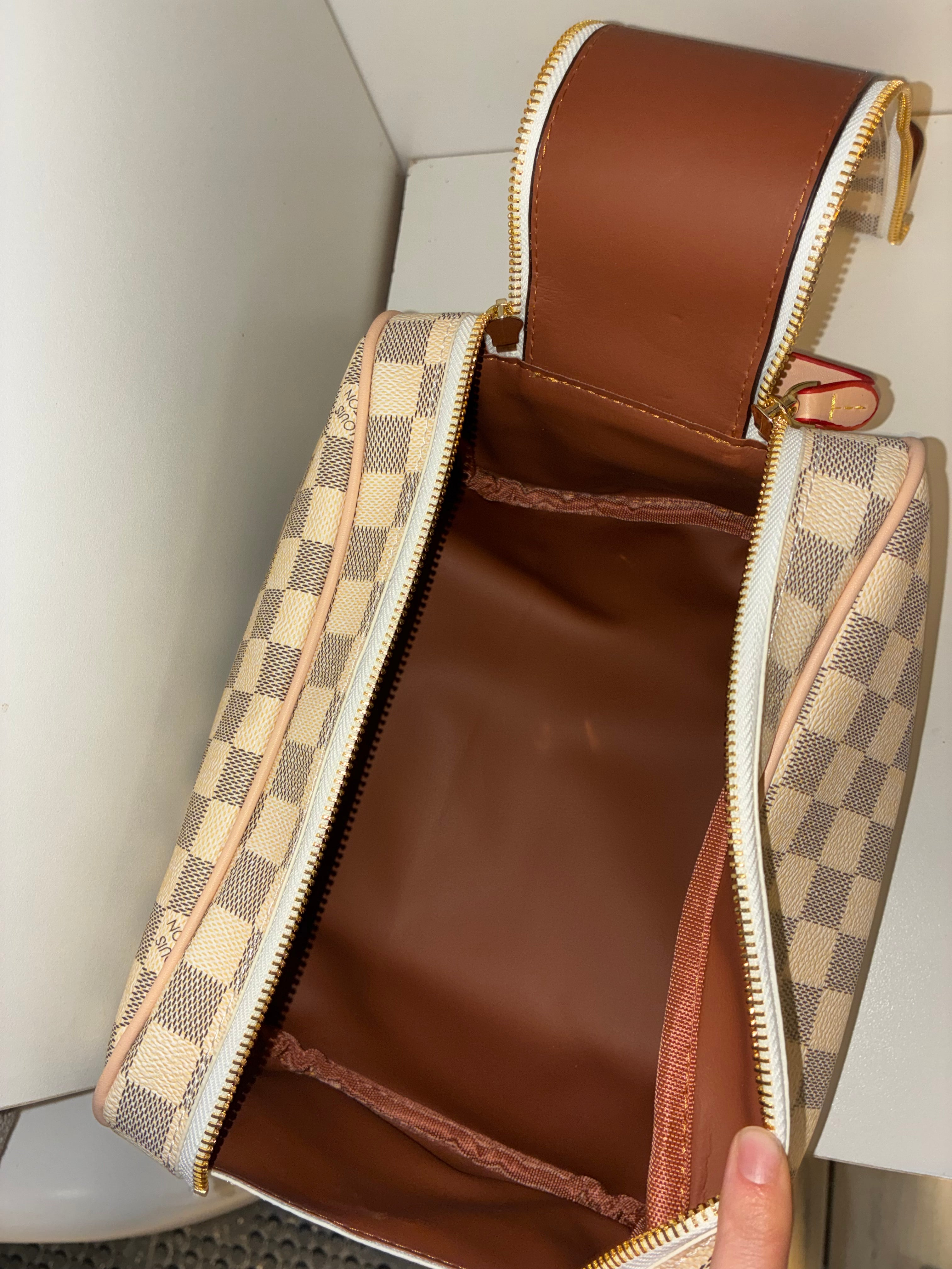 LV Toiletry Dopp Kit in the Damier Azur canvas pattern.