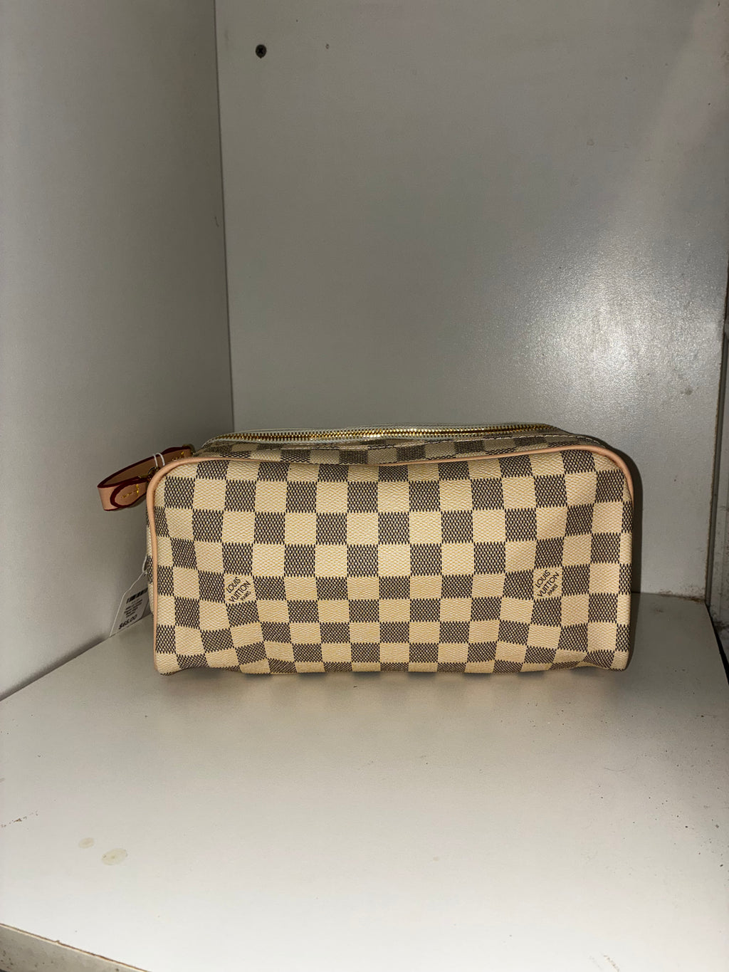 LV Toiletry Dopp Kit in the Damier Azur canvas pattern.